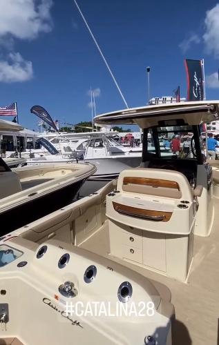 Slide: The Image of 2024 Chris-Craft Catalina 28 boat at a marina, showcasing luxurious design. #Catalina28 - 9