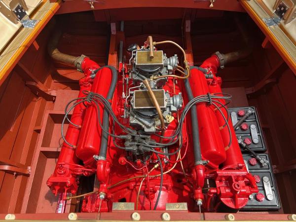Slide: The Image of 1955 Chris-Craft Cobra 21 engine, vibrant red, detailed view. - 11