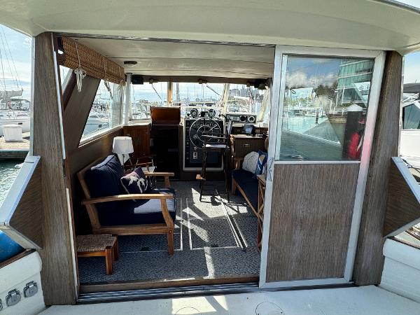 Slide: The Image of 1969 Chris-Craft Commander interior with wooden furnishings and nautical decor. - 44