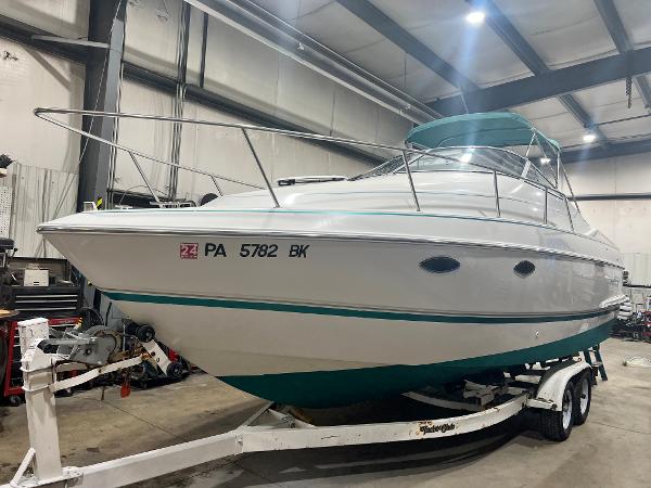 Slide: The Image of 1994 Chris-Craft 262 Crowne boat on trailer in indoor storage facility. - 0
