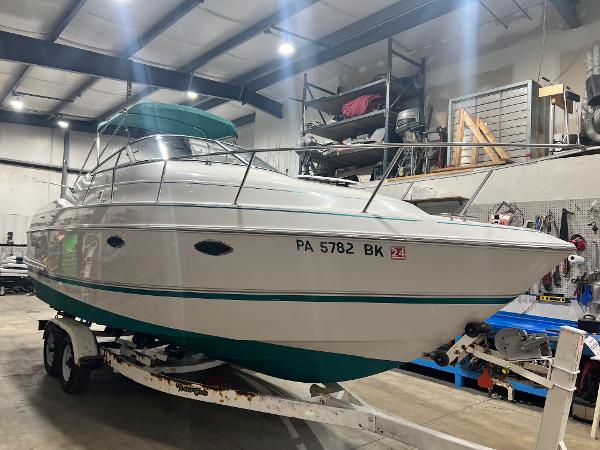 Slide: The Image of 1994 Chris-Craft 262 Crowne boat on trailer in indoor storage facility. - 1