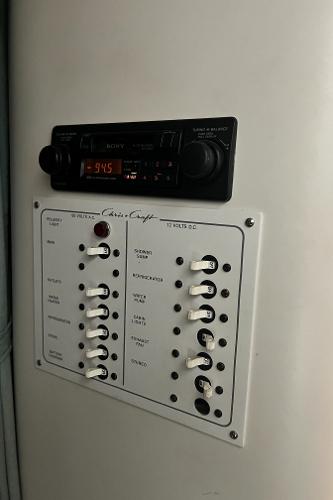 Slide: The Image of 1994 Chris-Craft 262 Crowne control panel and radio system. - 14