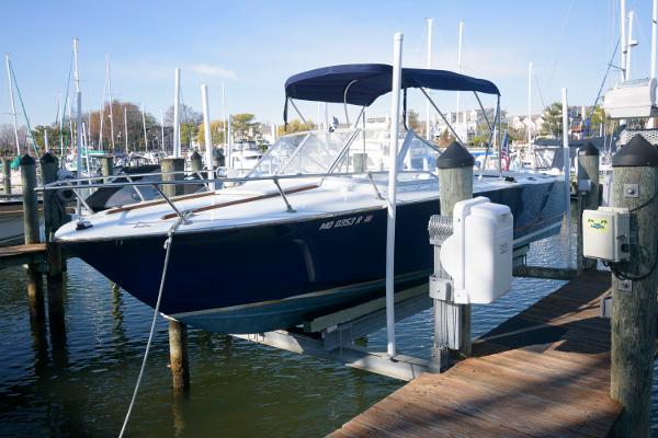 Slide: The Image of 1972 Chris-Craft Lancer 23 boat docked at a marina. - 0