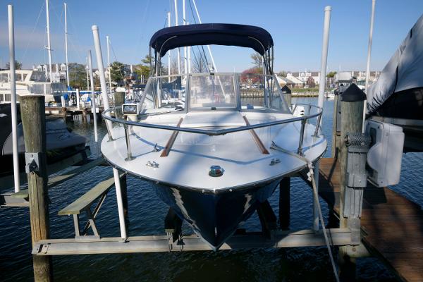 Slide: The Image of 1972 Chris-Craft Lancer 23 boat docked at a marina. - 1