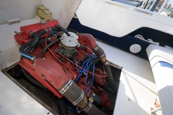 Slide: The Image of 1972 Chris-Craft Lancer 23 boat engine compartment with red engine. - 12