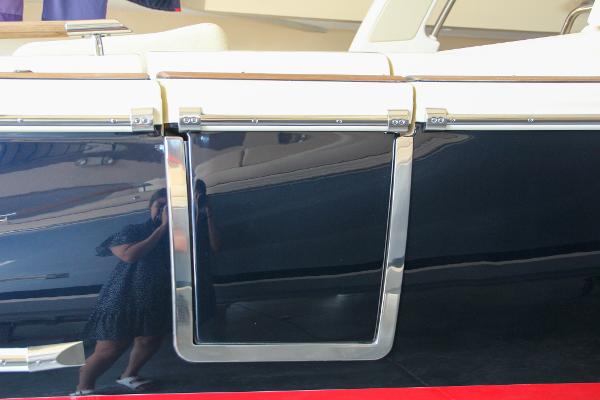 Slide: The Image of 2022 Chris-Craft Launch 25 GT boat side view with sleek design and reflective surface. - 18