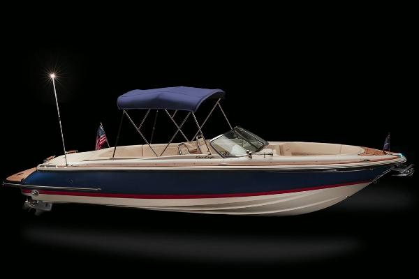 Slide: The Image of 2020 Chris-Craft Launch 27 boat with blue hull and canopy, side view on black background. - 21