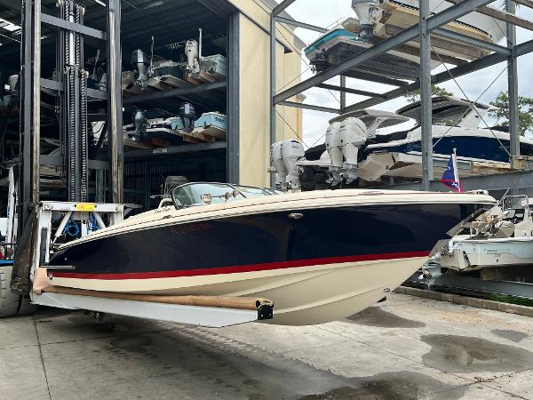 Slide: The Image of 2022 Chris-Craft Launch 27 boat in storage facility. - 1