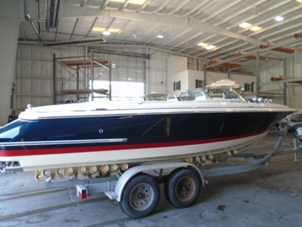 Slide: The Image of 2022 Chris-Craft Launch 27 boat on trailer in indoor storage facility. - 1