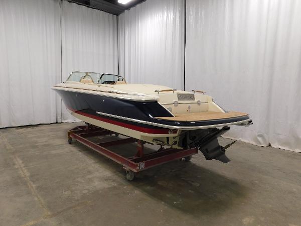 Slide: The Image of 2022 Chris-Craft Launch 27 boat in indoor storage on a trailer. - 10