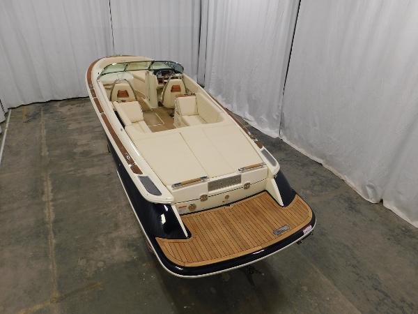 Slide: The Image of 2022 Chris-Craft Launch 27 boat with elegant design and spacious seating. - 11
