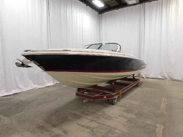 Slide: The Image of 2022 Chris-Craft Launch 27 boat in indoor showroom on trailer. - 12