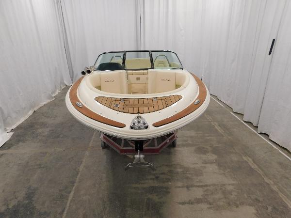 Slide: The Image of 2022 Chris-Craft Launch 27 boat in showroom, front view. - 14