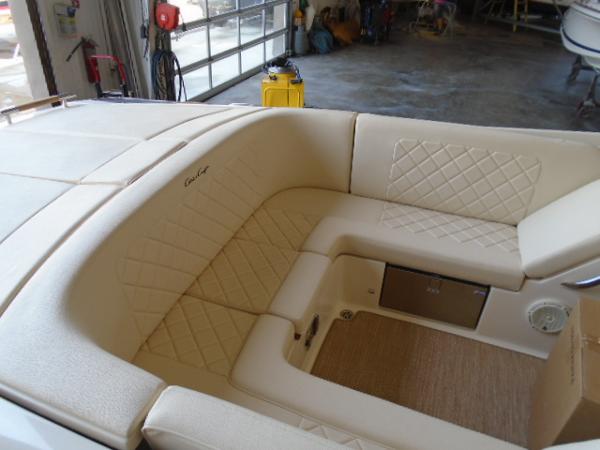 Slide: The Image of Luxurious interior of 2022 Chris-Craft Launch 27 boat with beige upholstery. - 16