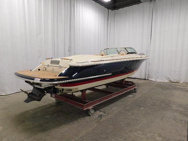 Slide: The Image of 2022 Chris-Craft Launch 27 boat in indoor storage, side view. - 7
