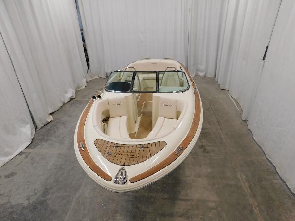 Slide: The Image of 2023 Chris-Craft Launch 27 boat in showroom. - 7