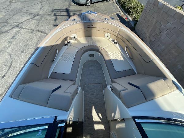 Slide: The Image of 2024 Chris-Craft Launch 28 GT boat interior with beige seating and elegant design. - 10