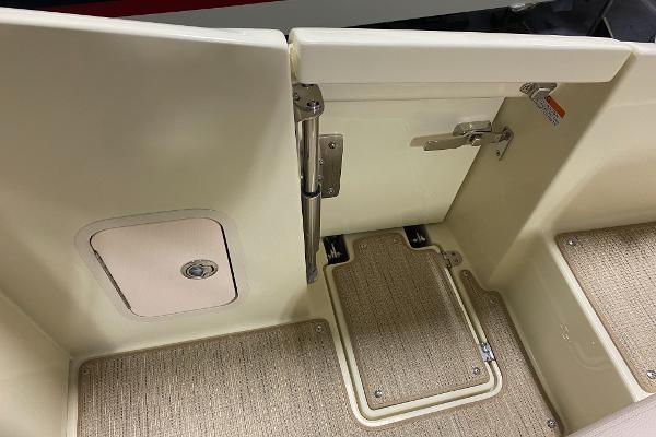 Slide: The Image of 2025 Chris-Craft Launch 28 GT interior with beige flooring and storage compartments. - 12