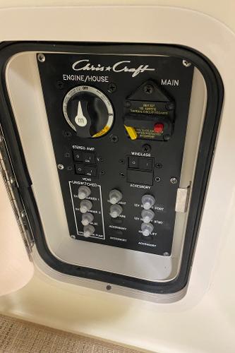 Slide: The Image of Control panel of 2025 Chris-Craft Launch 28 GT boat, featuring engine and accessory switches. - 13