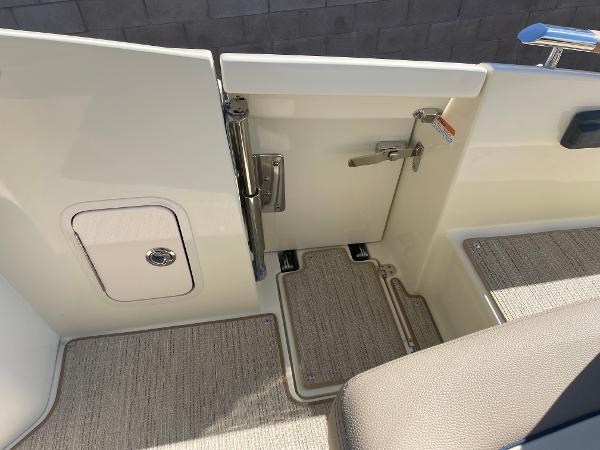 Slide: The Image of 2024 Chris-Craft Launch 28 GT boat interior, featuring a sleek entryway and secure latch. - 14