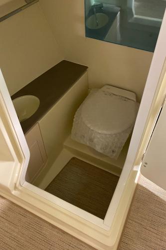Slide: The Image of 2025 Chris-Craft Launch 28 GT boat bathroom interior with sink and toilet. - 17
