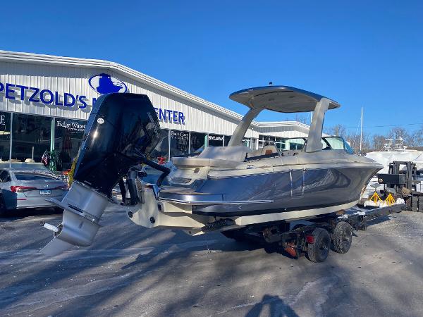Slide: The Image of 2025 Chris-Craft Launch 28 GT boat on trailer at dealership. - 2