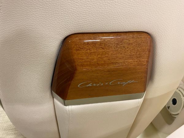 Slide: The Image of 2025 Chris-Craft Launch 28 GT interior detail with wood accent and logo. - 25