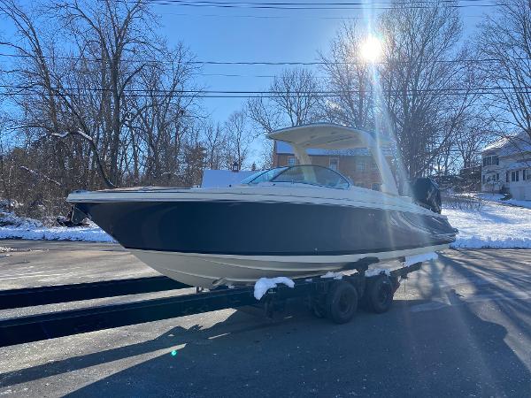 Slide: The Image of 2025 Chris-Craft Launch 28 GT boat on trailer in snowy setting. - 4