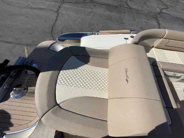 Slide: The Image of 2024 Chris-Craft Launch 28 GT boat interior with beige and cream seating. - 6