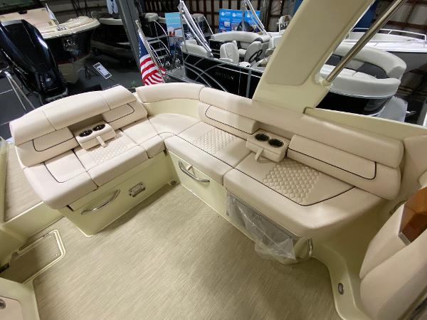 Slide: The Image of Luxurious interior of 2025 Chris-Craft Launch 28 GT boat with beige seating. - 8