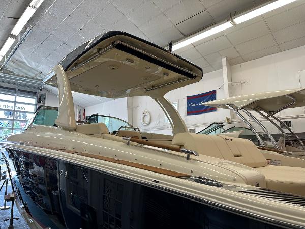 Slide: The Image of 2024 Chris-Craft Launch 31 GT luxury boat in showroom. - 1