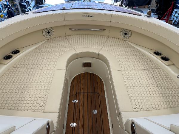 Slide: The Image of 2024 Chris-Craft Launch 31 GT boat interior with luxurious beige seating and teak flooring. - 15