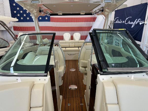 Slide: The Image of 2024 Chris-Craft Launch 31 GT interior with luxurious seating and wooden flooring. - 17