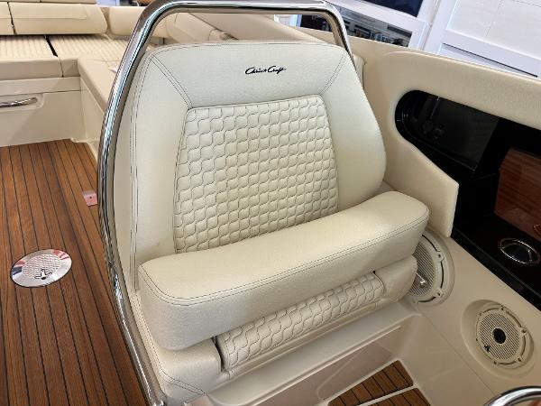Slide: The Image of 2024 Chris-Craft Launch 31 GT boat interior with luxurious seating and wooden flooring. - 18