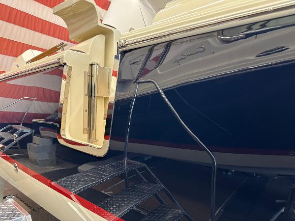 Slide: The Image of 2024 Chris-Craft Launch 31 GT boat with open side door and steps. - 2