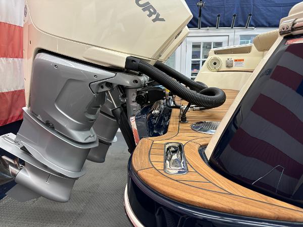 Slide: The Image of 2024 Chris-Craft Launch 31 GT boat with Mercury outboard motor and teak deck. - 22