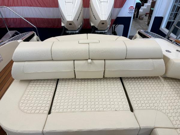 Slide: The Image of 2024 Chris-Craft Launch 31 GT boat with beige leather seating and twin outboard engines. - 5