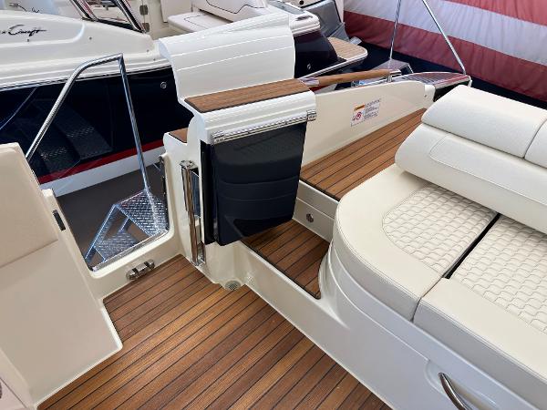 Slide: The Image of 2024 Chris-Craft Launch 31 GT interior with teak flooring and luxurious seating. - 6