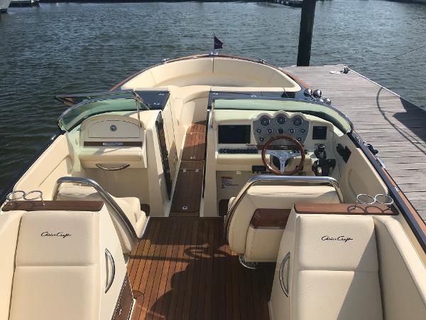 Slide: The Image of 2019 Chris-Craft Launch 34 boat interior with elegant seating and wooden deck. - 10