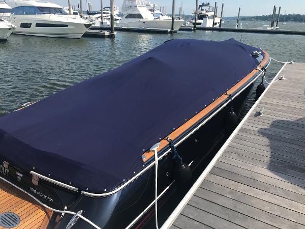 Slide: The Image of 2019 Chris-Craft Launch 34 boat covered at marina dock. - 12