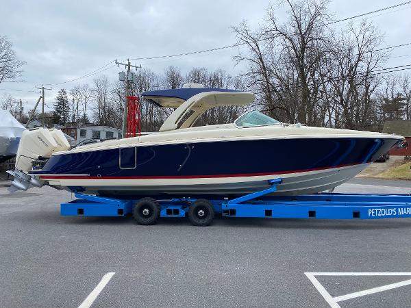 Slide: The Image of 2024 Chris-Craft LAUNCH GT 35 boat on a blue trailer at Petzold's Marine. - 1