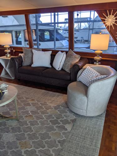 Slide: The Image of Luxurious interior of a 1976 Chris-Craft Roamer yacht with elegant seating and decor. - 17