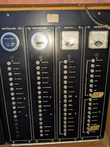 Slide: The Image of 1976 Chris-Craft Roamer electrical control panel with gauges and switches. - 34