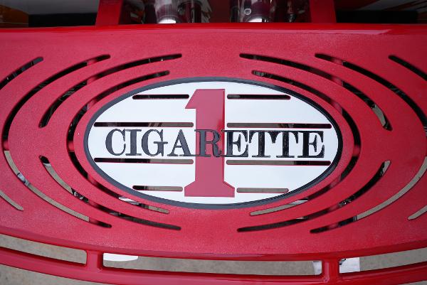 Slide: The Image of 2005 Cigarette 38 Top Gun logo on red background - 10