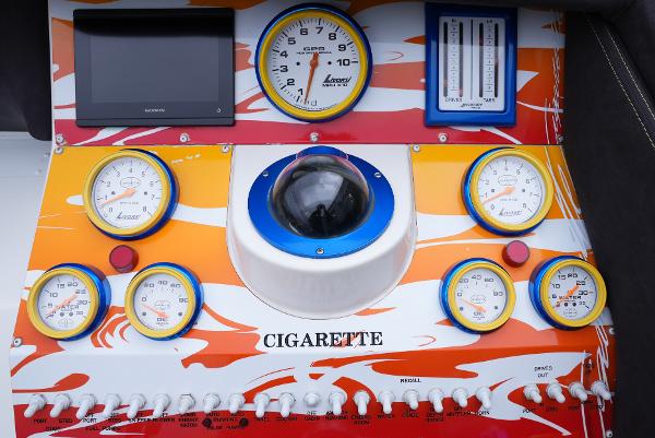 Slide: The Image of Control panel of a 2005 Cigarette 38 Top Gun boat with gauges and switches. - 23