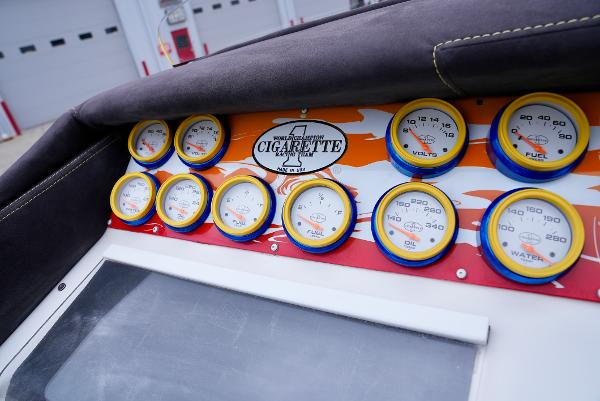 Slide: The Image of Dashboard of a 2005 Cigarette 38 Top Gun boat with multiple gauges. - 24