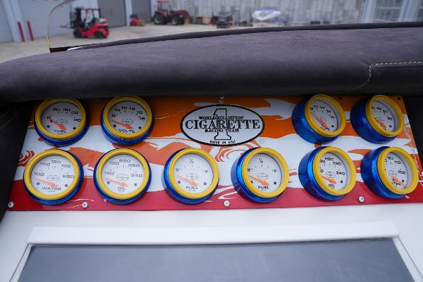 Slide: The Image of Dashboard of a 2005 Cigarette 38 Top Gun boat with gauges and logo. - 25