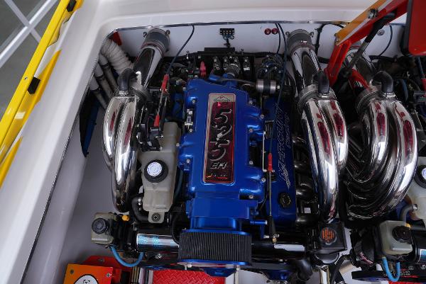 Slide: The Image of 2005 Cigarette 38 Top Gun engine compartment with blue 525 EFI engine. - 27