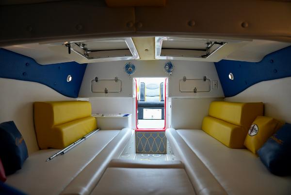 Slide: The Image of Interior of 2005 Cigarette 38 Top Gun boat with yellow and white seating. - 28