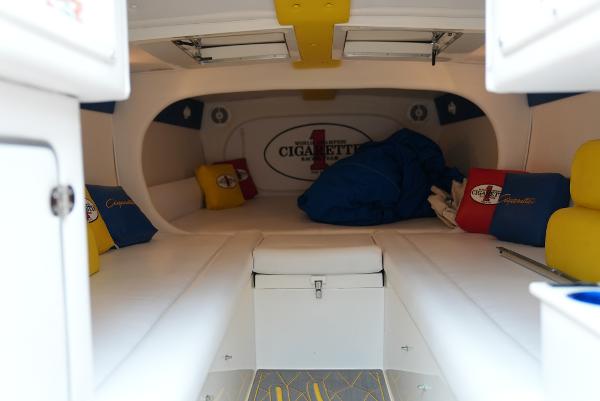 Slide: The Image of Interior cabin of a 2005 Cigarette 38 Top Gun boat with colorful cushions. - 30